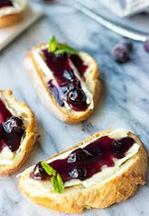 Warm Brie with Blueberry, Lemon & Thyme Compote over Crostini